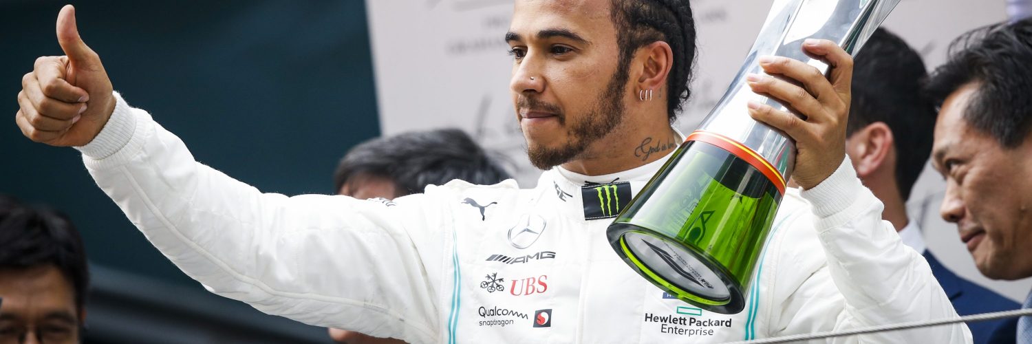 Lewis Hamilton celebrates winning the 1000th grand prix