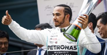 Lewis Hamilton celebrates winning the 1000th grand prix